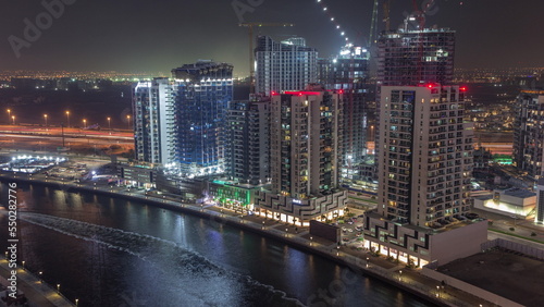 Towers at the Business Bay aerial night timelapse in Dubai  United Arab Emirates