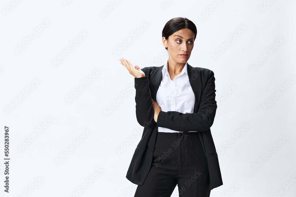 Business woman in black business suit shows signals gestures and emotions on white background, freelancer job online time management, teacher science Business woman in black business suit shows signals gestures and emotions on white background, freelancer job online time management, teacher science