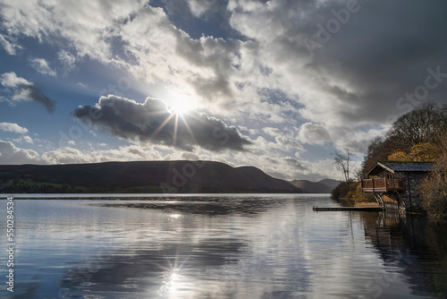 Print op canvas Ullswater boathouse with sun flare