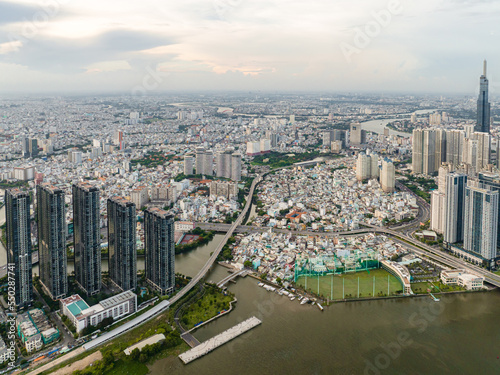 Top view aerial photo from flying drone of a Ho Chi Minh City with development buildings, transportation, energy power infrastructure. Financial and business centers in developed Vietnam.