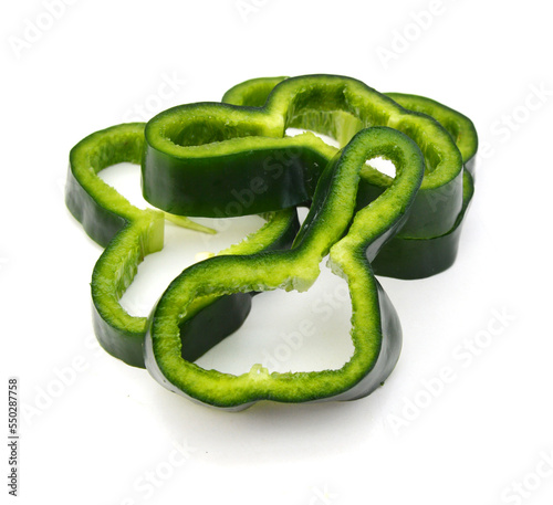 Stack dark green poblano peppers isolated on white 