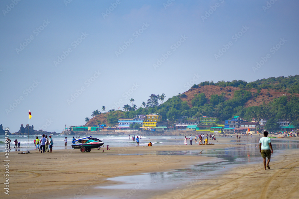 Arambol beach with people in Goa India 