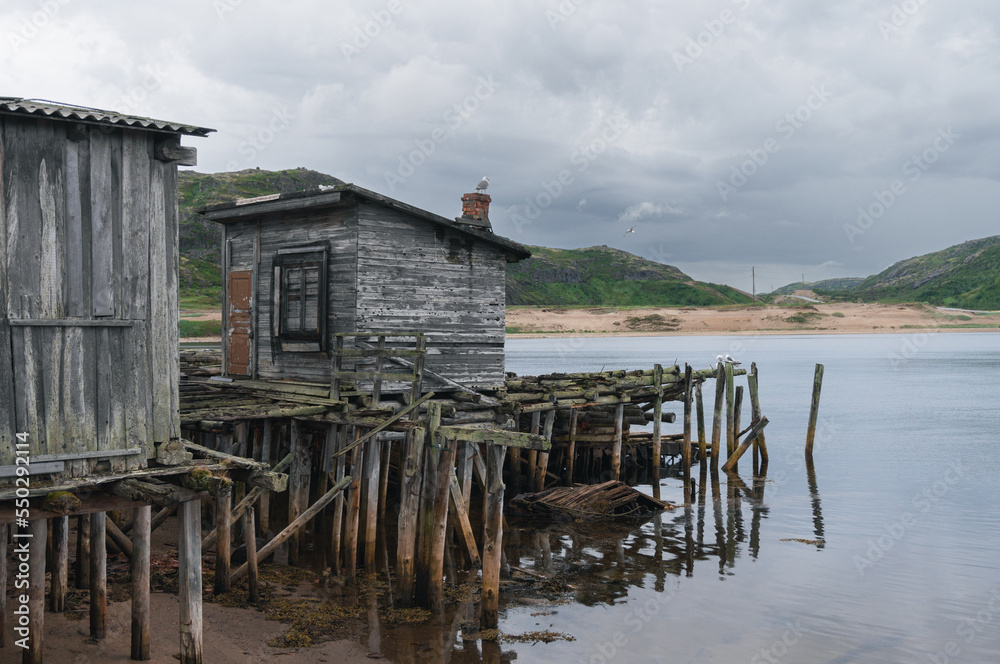 wooden houses on stilts in the water. Teriberka, Russia wooden houses on stilts in the water. Teriberka, Russia