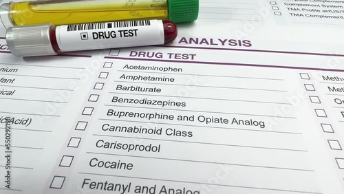 blood and urine samples from a patient for drug control. Tubes with blood and urine on a drug analysis test request document
