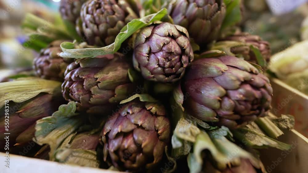 Fresh artichokes at farmers market. Closeup of organic food on display Fresh artichokes at farmers market. Closeup of organic food on display