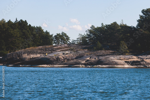Archipelago National Park landscape, Southwest Finland, with islands, islets and skerries, Saaristomeren kansallispuisto, summer sunny day, view from shuttle ship ferry boat in the Archipelago Sea photo