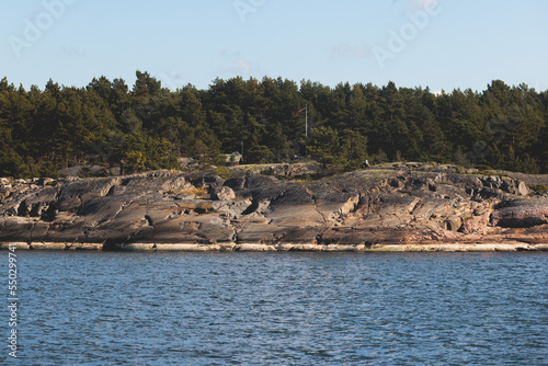 Archipelago National Park landscape, Southwest Finland, with islands, islets and skerries, Saaristomeren kansallispuisto, summer sunny day, view from shuttle ship ferry boat in the Archipelago Sea photo