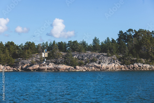Archipelago National Park landscape, Southwest Finland, with islands, islets and skerries, Saaristomeren kansallispuisto, summer sunny day, view from shuttle ship ferry boat in the Archipelago Sea photo