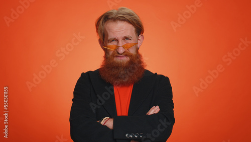 Fotografie Sad redhead bearded man feeling hopelessness and loneliness, nervous breakdown, loses becoming surprised by lottery results, bad fortune, loss, unlucky news