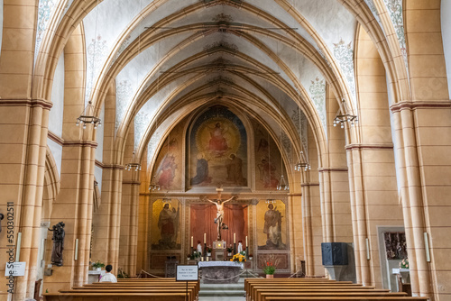 The central nave inside the famous St. Gangolf's Church, a Roman Catholic church in Trier, Germany. The end of the choir has a fresco created by the Trier painter August Gustav Lasinsky in 1850.