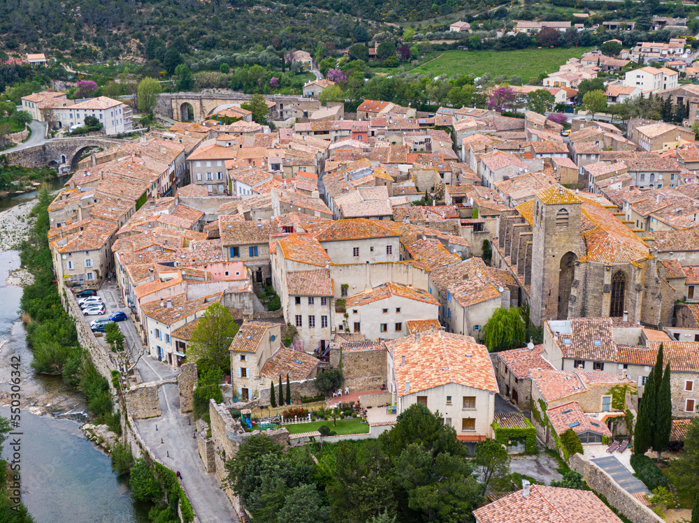 Aerial view of Lagrasse medieval city, Aude, Occitanie. the city is built along the river Orbieu