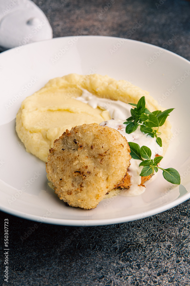 Fish cutlet with mashed potatoes and sauce Fish cutlet with mashed potatoes and sauce
