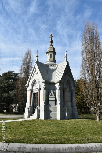 Vertical shot of a mausoleum  before the blue skyline on a sunny day