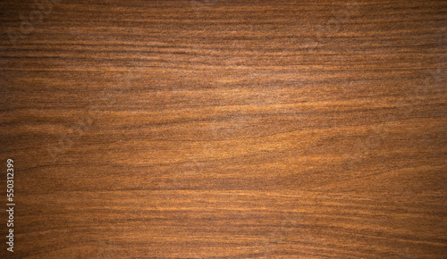 Photo of the texture of natural mahogany for the manufacture of luxury furniture.Wooden background for text. beautiful texture of the wooden background.