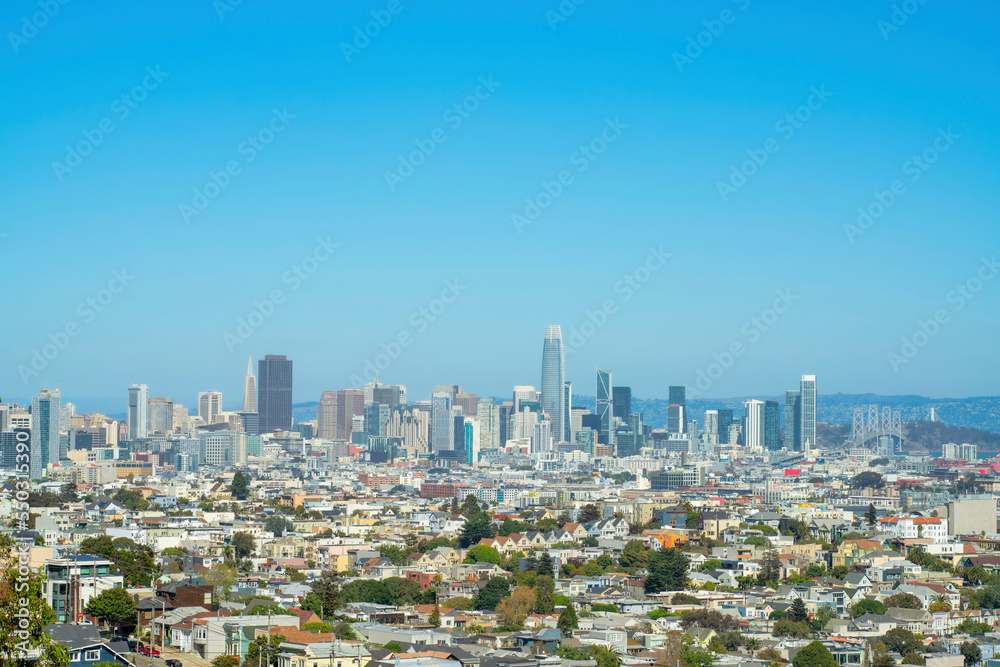 Skyscrappers in distance with sprawling suburban and urban neighborhoods in the historic districts of san francisco california