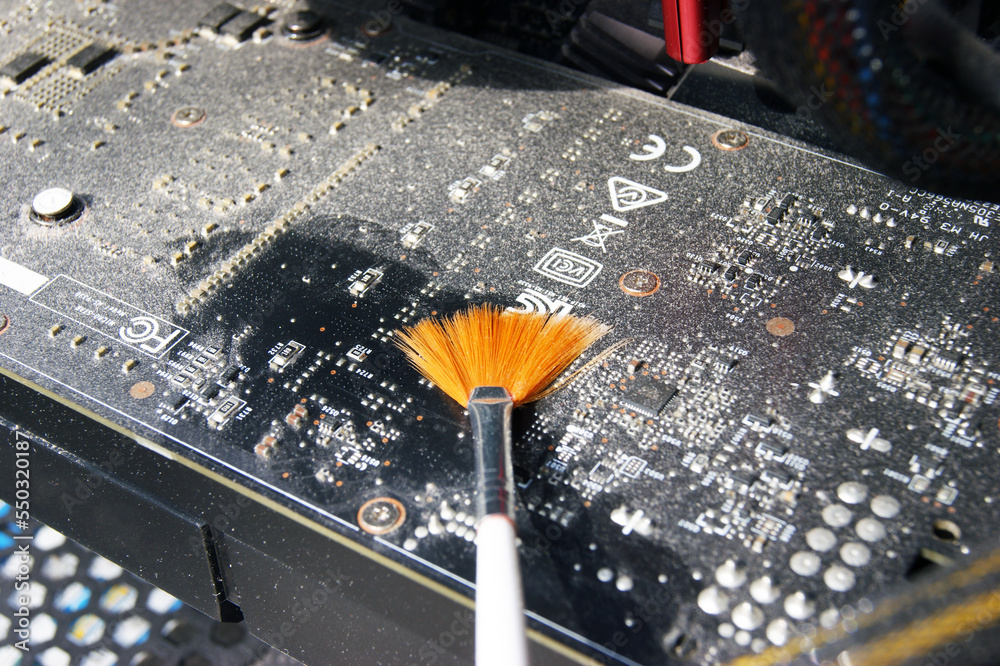 Cleaning a very dusty video card AMD Radeon R7 200 Series with a brush ...