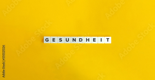 Gesundheit Banner. Letter Tiles on Yellow Background. Minimal Aesthetics.