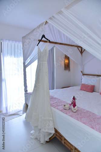 wedding dress on the bed © liligluck
