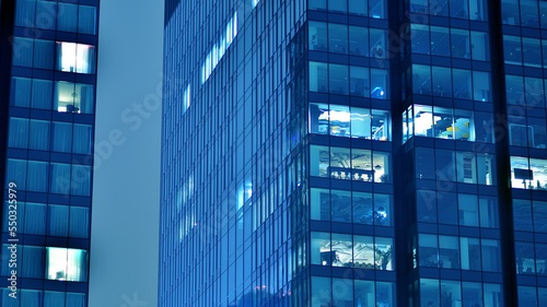 Wallpaper Mural Pattern of office buildings windows illuminated at night. Glass architecture ,corporate building at night - business concept. Blue graphic filter. Torontodigital.ca