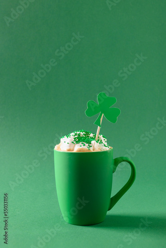 Wallpaper Mural Irish coffee in green cup with whipped cream and sprinkles for St Patricks Day on green background. Close up. Copy space. Vertical format. Minimal style. Monochrome. Torontodigital.ca