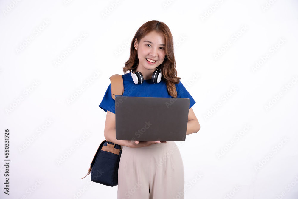 Portrait of happy young asian student girl using laptop computer isolated over white background Portrait of happy young asian student girl using laptop computer isolated over white background