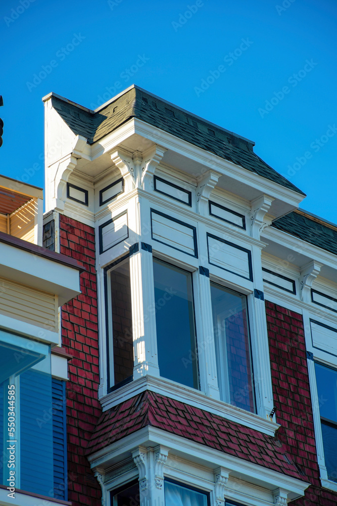 Decorative building facade on exterior of house or home in the suburban part of the historic districts of san francisco california