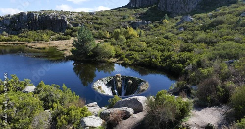 Covão dos Conchos in Serra da Estrela, Portugal. Travel and adventure. Nomad life. Hiking lifestyle. Best destinations in the world. Human made construction on the lake. photo