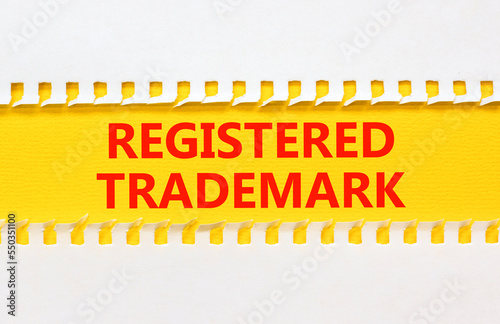 Registered trademark symbol. Concept word Registered trademark on yellow and white paper. Beautiful yellow and white background. Business and registered trademark concept. Copy space.