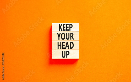 Keep your head up symbol. Concept words Keep your head up on wooden cubes. Beautiful white table white background. Business motivational keep your head up concept. Copy space.