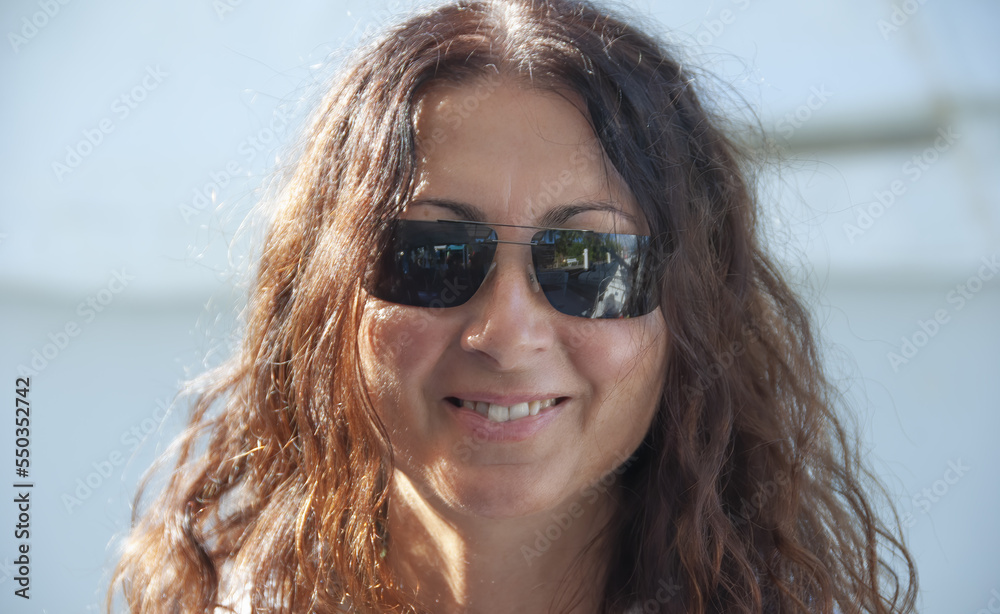 Portrait of a happy caucasian woman relaxing on a beautiful beach Portrait of a happy caucasian woman relaxing on a beautiful beach