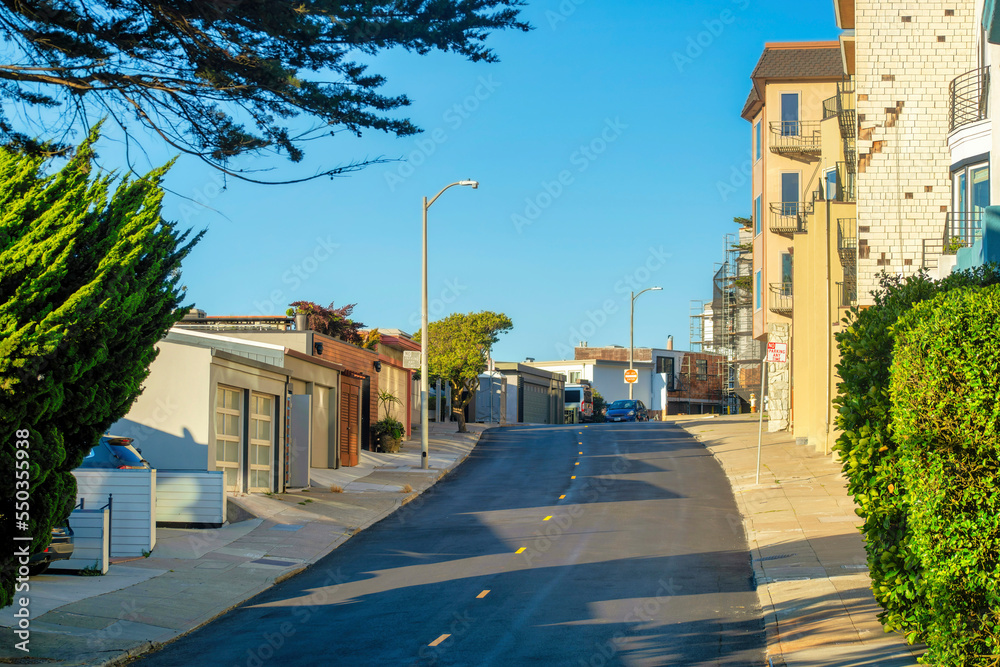 View down modern winding road in the historic districts of san francisco california in the downtown city and neighborhood streets View down modern winding road in the historic districts of san francisco california in the downtown city and neighborhood streets