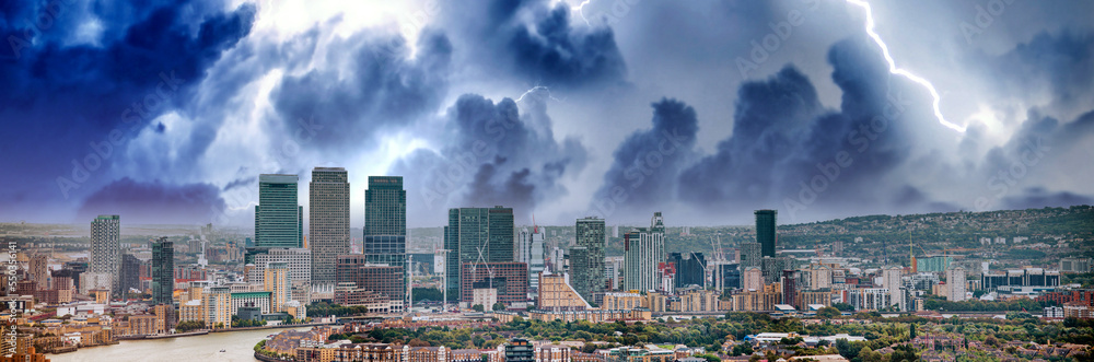 London - UK. Aerial panoramic view of Canary Wharf modern buildings during a storm London - UK. Aerial panoramic view of Canary Wharf modern buildings during a storm