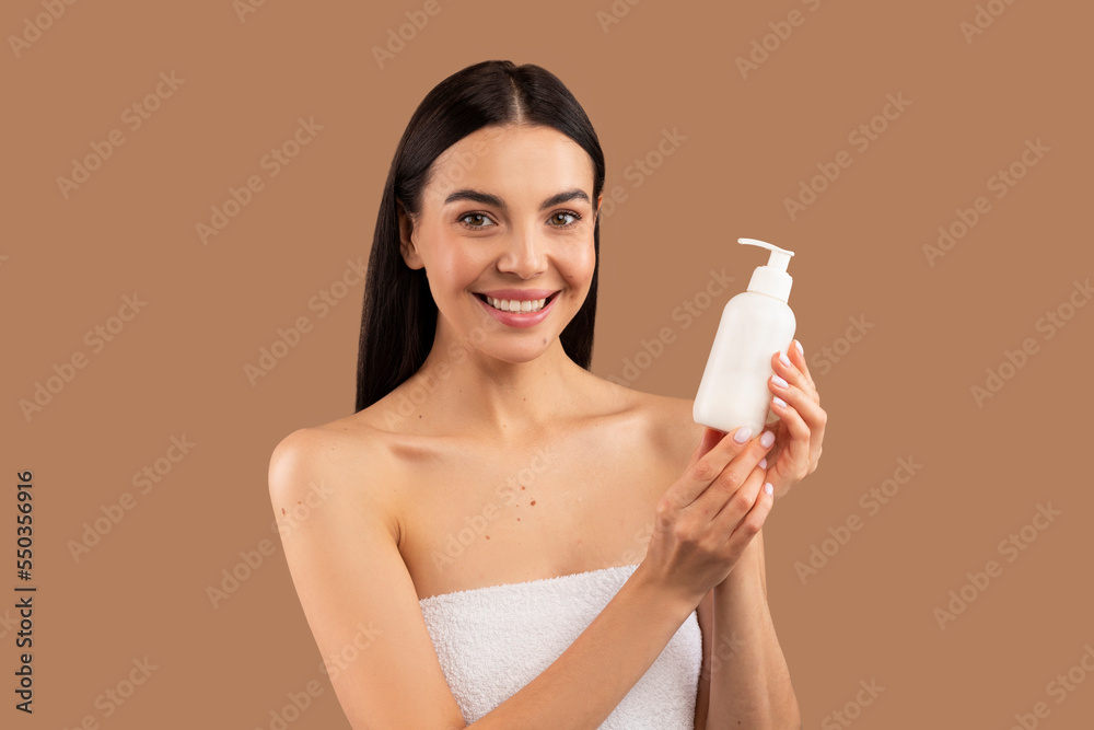 Close up portrait of beautiful half-naked woman showing beauty product Close up portrait of beautiful half-naked woman showing beauty product
