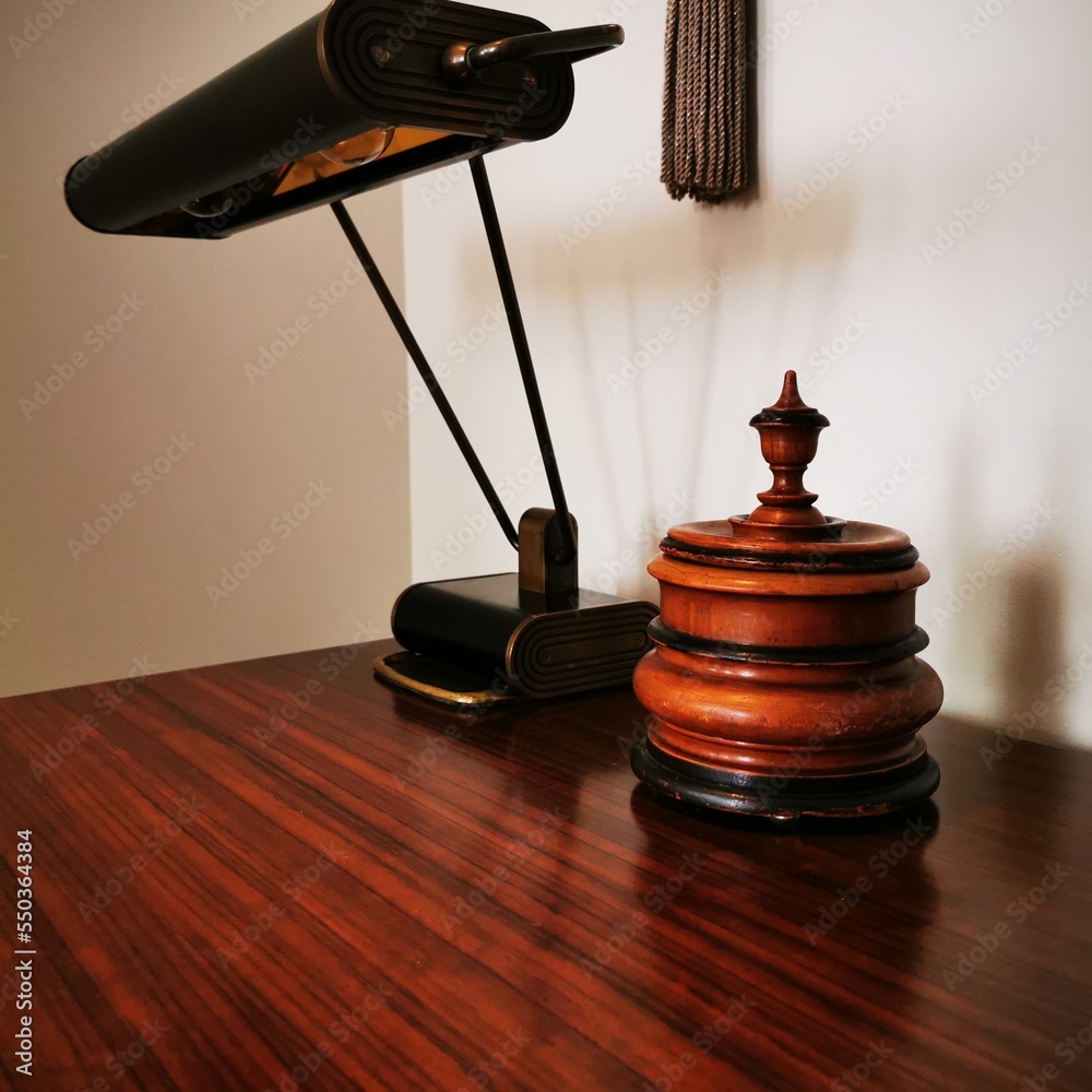 Antique table lamp and tobacco jar on the table. Antique table lamp and tobacco jar on the table.