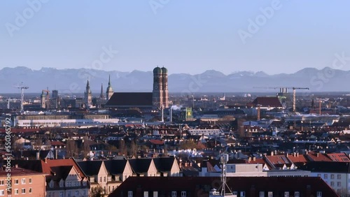 Frauenkirche against alpine panorama in Munich, Germany photo