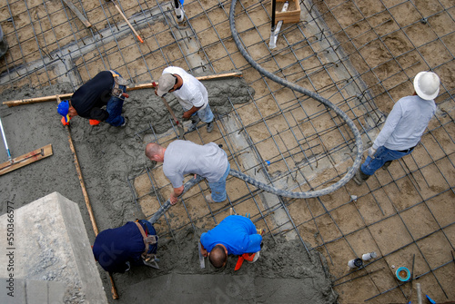 Pouring a large concrete slab on a construction project, high angle view 