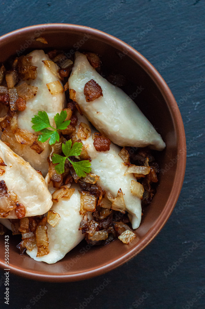 national Ukrainian dish, traditional varenyki with potatoes, cabbage, crackers made of lard and fried onions, food of the countries of the world, gastrotourism, culture of Ukraine national Ukrainian dish, traditional varenyki with potatoes, cabbage, crackers made of lard and fried onions, food of the countries of the world, gastrotourism, culture of Ukraine