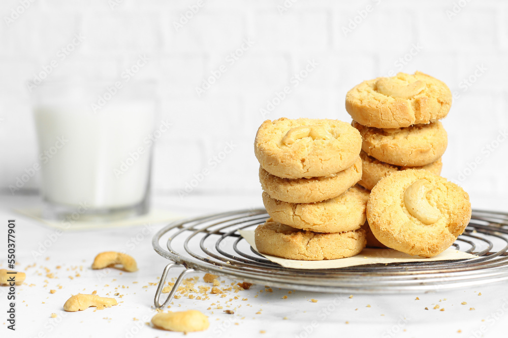 cookies stacked with milk on white background 