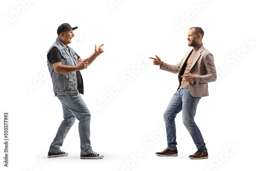 Full length profile shot of happy father and son dancing