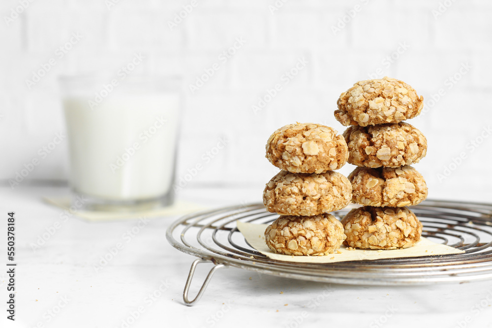 cookies stacked with milk on white background 