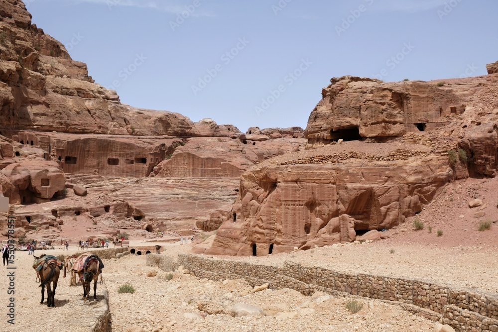 Street of Facades and dry riverbad of Wadi Musa in Petra, Jordan. Petra is ancient Nabataean city, considered one of seven new wonders of world and is world heritage site. Street of Facades and dry riverbad of Wadi Musa in Petra, Jordan. Petra is ancient Nabataean city, considered one of seven new wonders of world and is world heritage site.