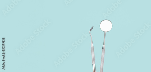 Dentist Professional tools medical equipment on Blue background. Dental Hygiene and Health conceptual image Dental tools on blue background. Medical technology concept.
