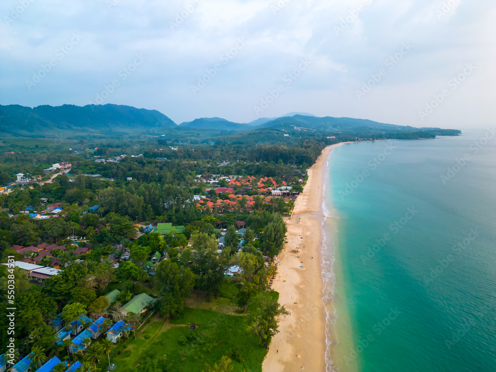 Aerial drone view of tropical beach at Ko Lanta island, Thailand. Coastline view of famous target destination. Pure turquoise water and white sand.