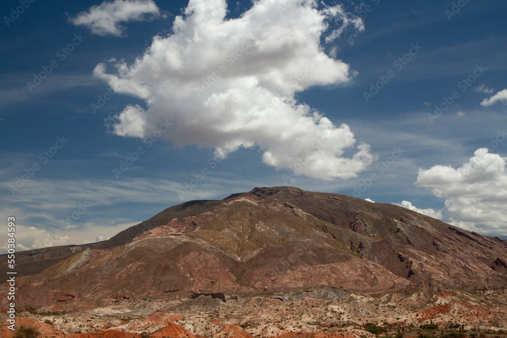 Geology. Beautiful view of Los Cardones National Park in Salta, Argentina. View of the rocky mountains  under a magical sky with clouds. 