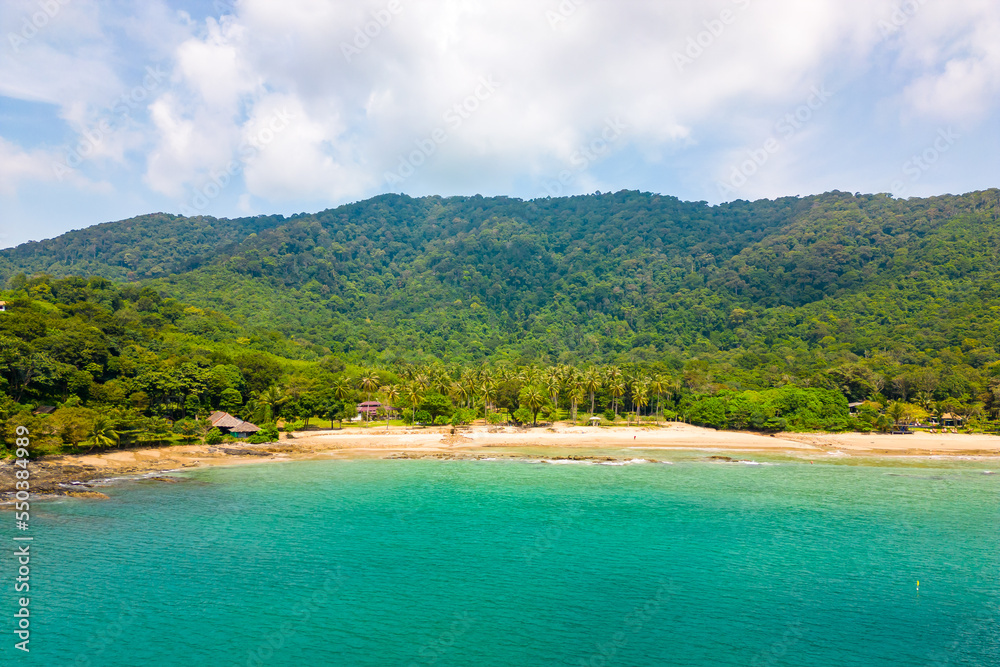 Fototapeta premium Aerial drone view of tropical beach at Ko Lanta island, Thailand. Coastline view of famous target destination. Pure turquoise water and white sand.