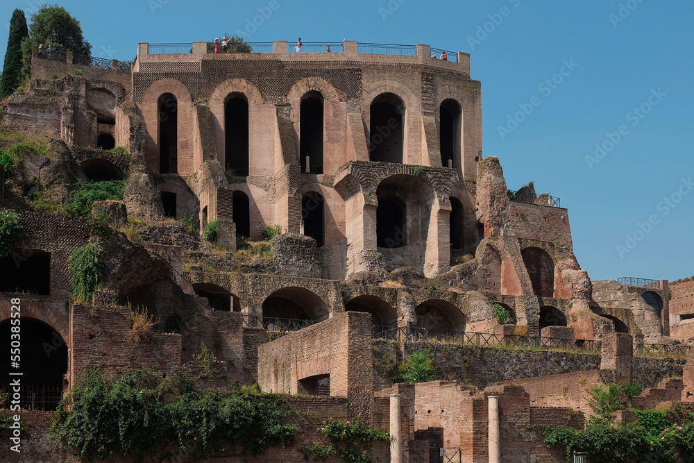 Rome, Italy - close-up of ancient ruins inside Palatine Hill, the first nucleus of the Roman Empire. View of famous landmark with arches. Tourist attraction horizontal background.
