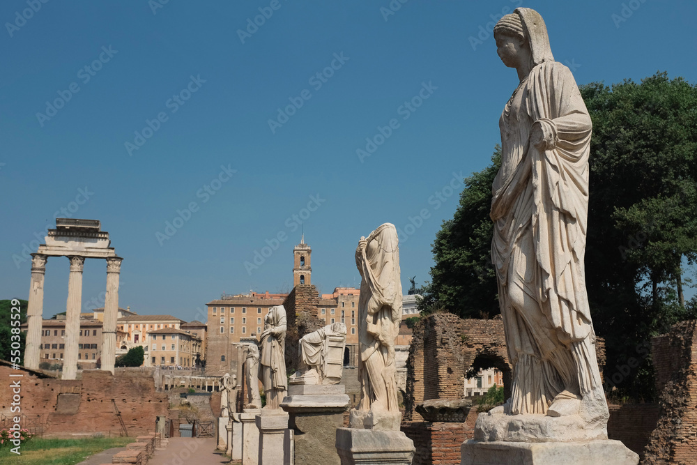 Rome, Italy - white statues of Vestal Virgins at the House of the Vestals. Ancient ruins at Roman Forum. Famous historical landmark at the foot of Palatine Hill. Tourist attraction.