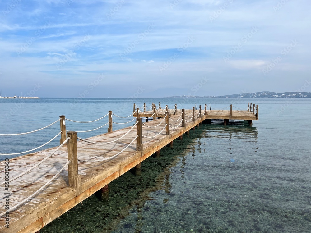 Beautiful wooden pier at the sea, sea horizon Beautiful wooden pier at the sea, sea horizon
