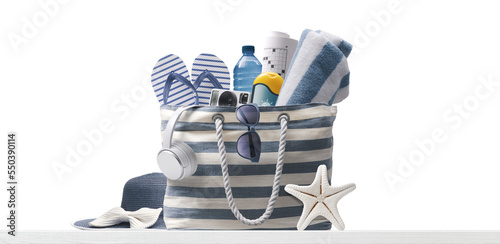 Fototapeta Naklejka Na Ścianę i Meble -  PNG file no background Beach bag with accessories and tropical beach