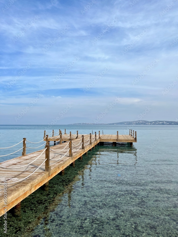 Beautiful wooden pier at the sea, sea horizon